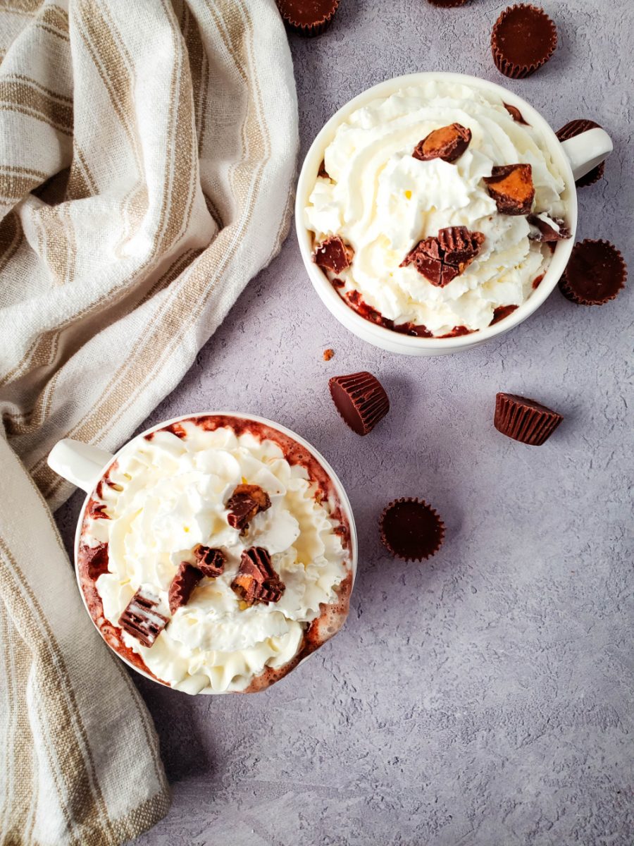 Peanut Butter Cup Hot Chocolate in mugs with toppings
