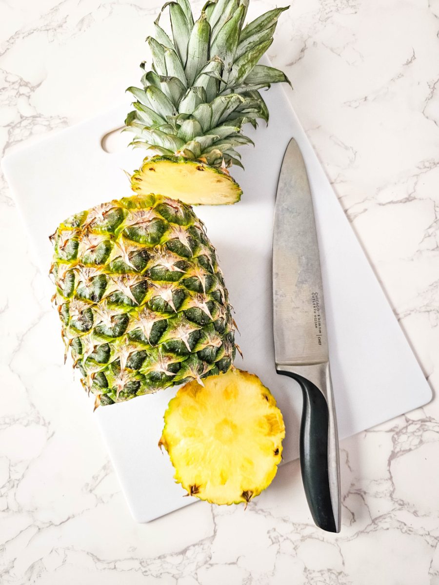 fresh pineapple being cut