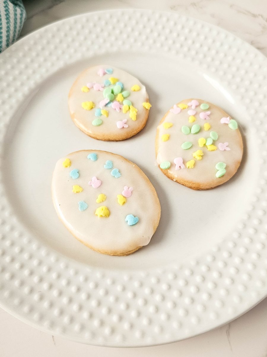 3 egg shaped frosted sugar cookies on white plate