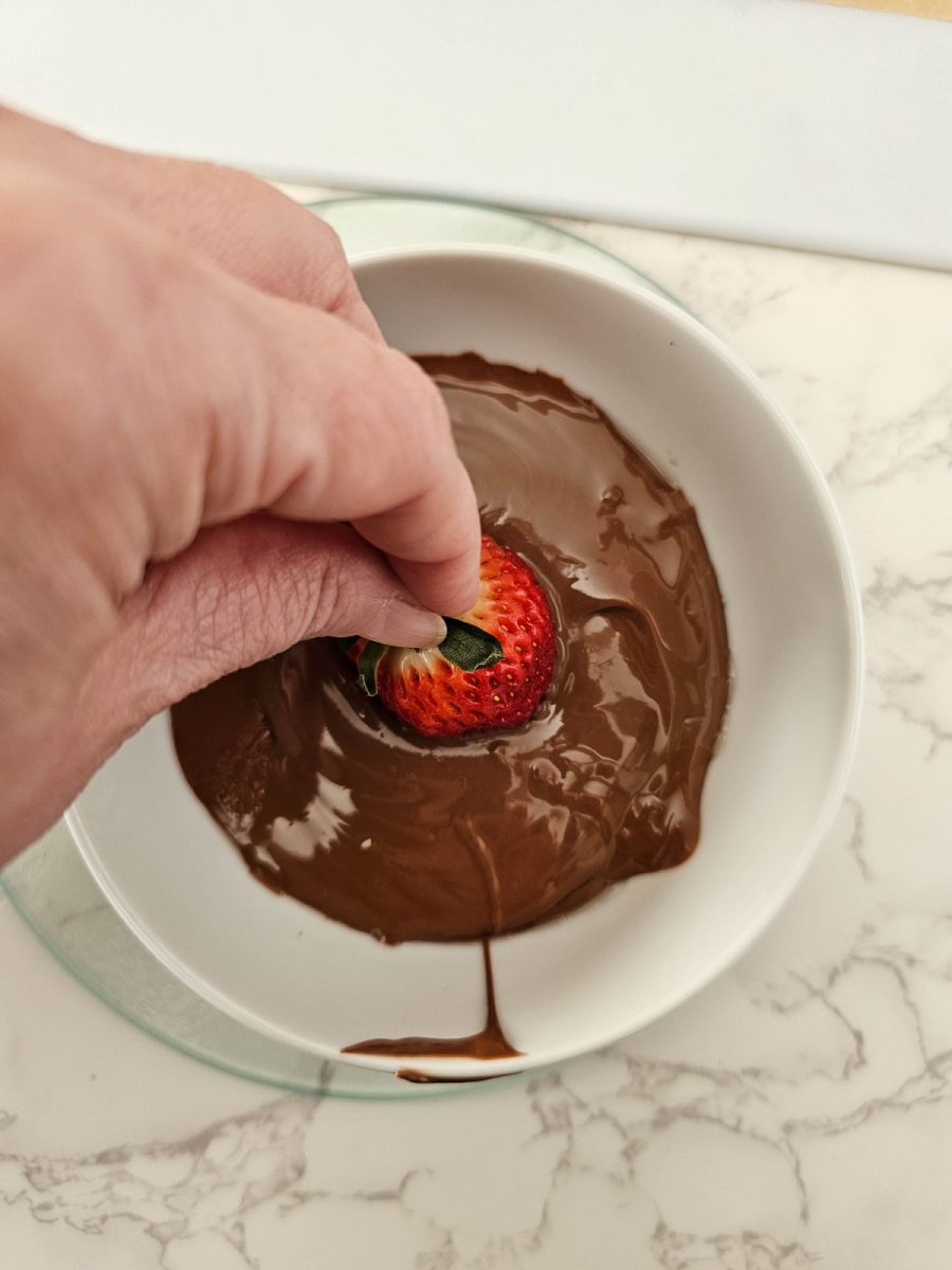 Dip strawberries into melted chocolate