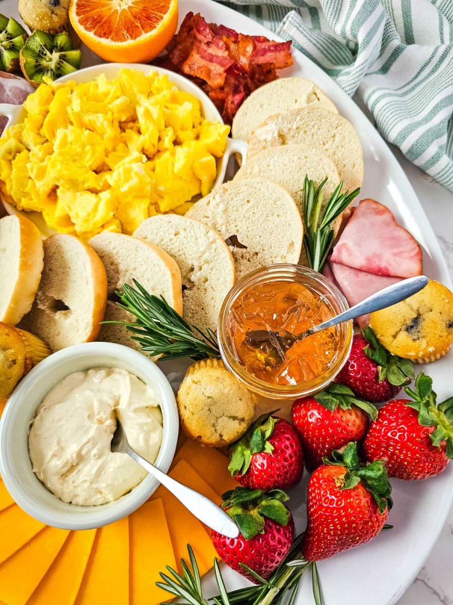 breakfast board with eggs and fruit on oval platter