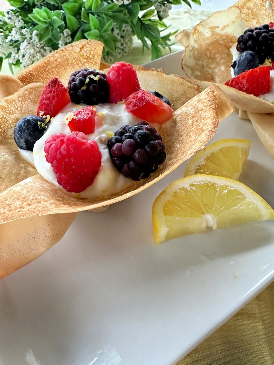 close up of crepe cup filled with lemon mousse and fruit