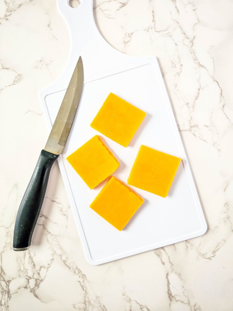 cut slices of cheese into fourths