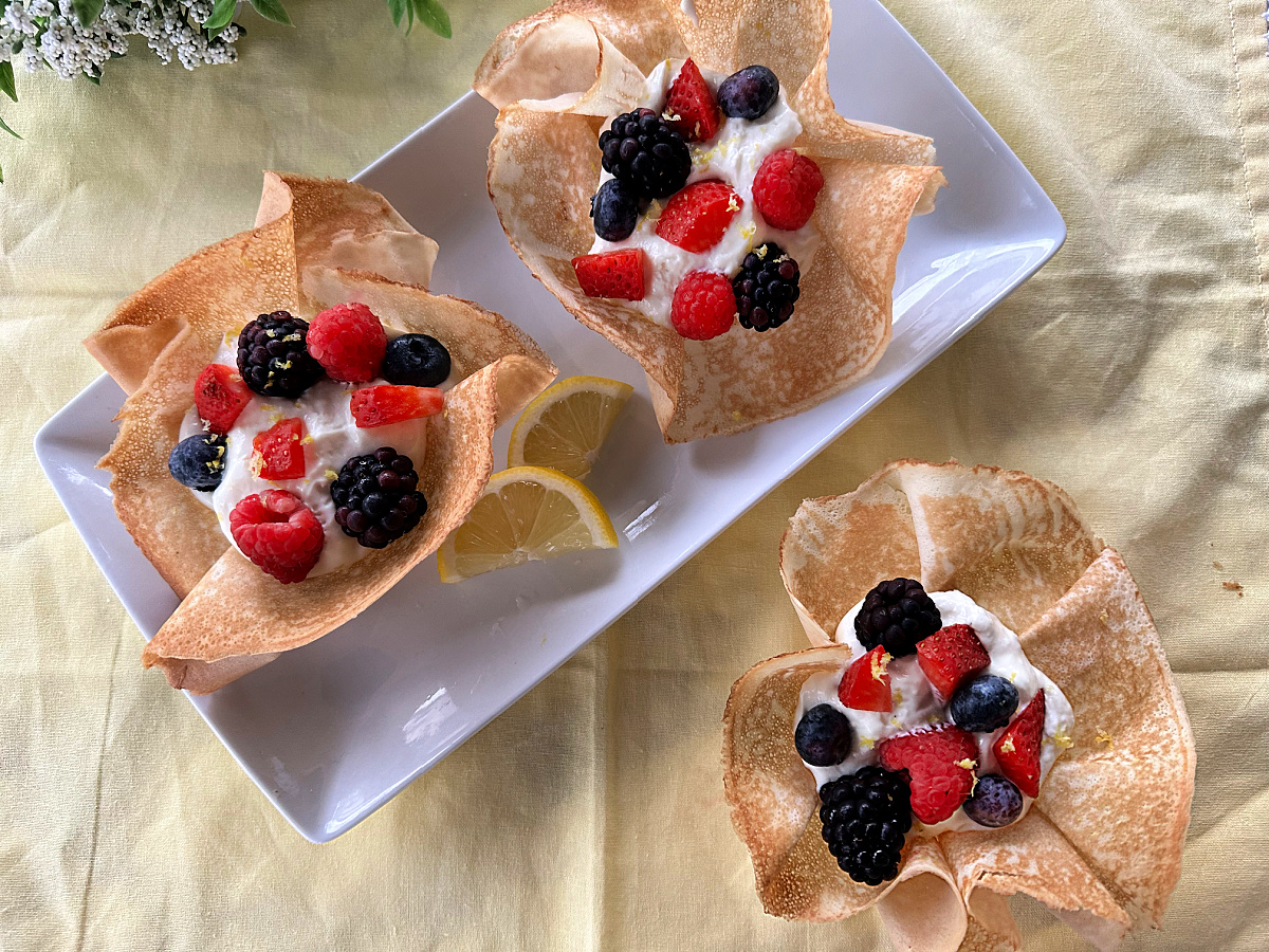 overhead view of crepe bowls filled with lemon mousse