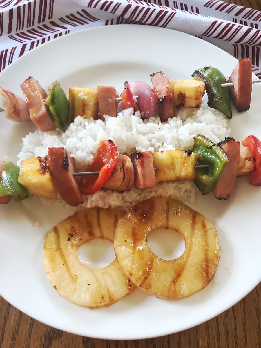 Grilled Hawaiian Ham Skewers on a bed of rice with pineapple slices