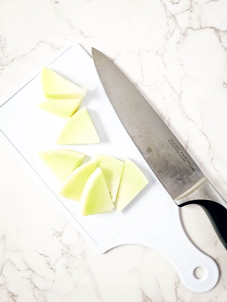 cutting honeydew melon into triangles