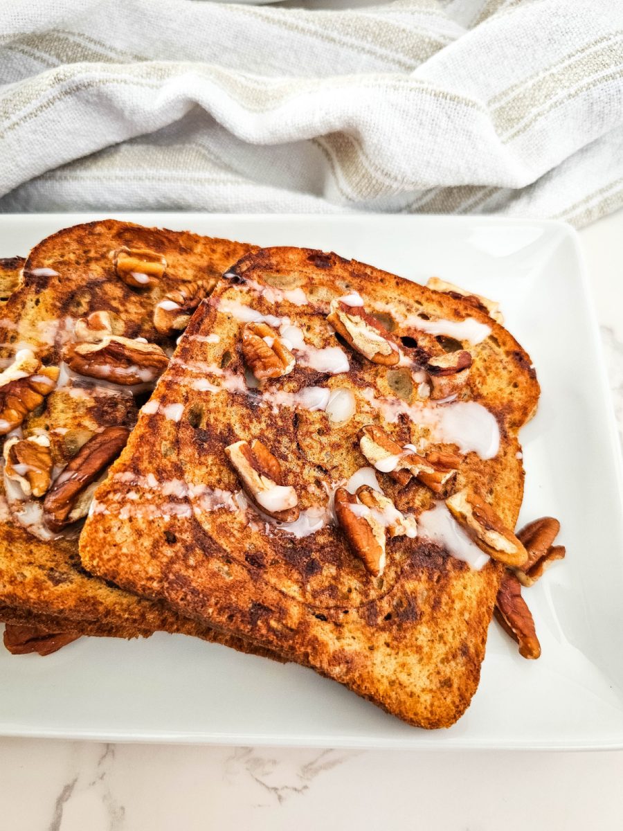 glazed cinnamon french toast with pecans on plate