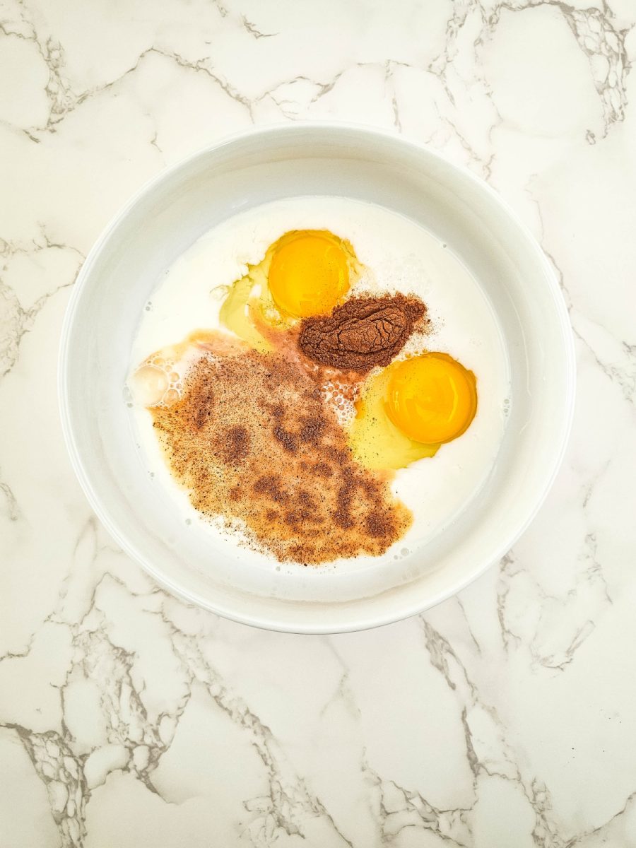 shallow bowl with milk, egg and spices
