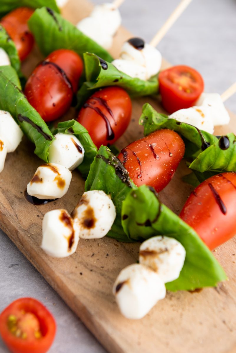 close up of tomato basils mozzarella skewers