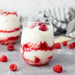 feature image of white chocolate mousse with raspberries