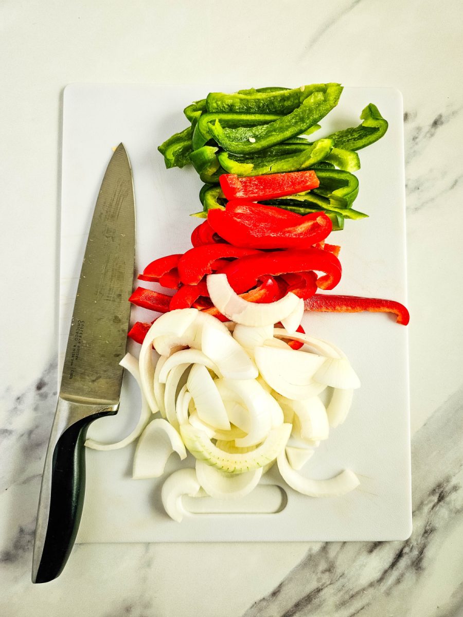 sliced vegetables on cutting board with knife