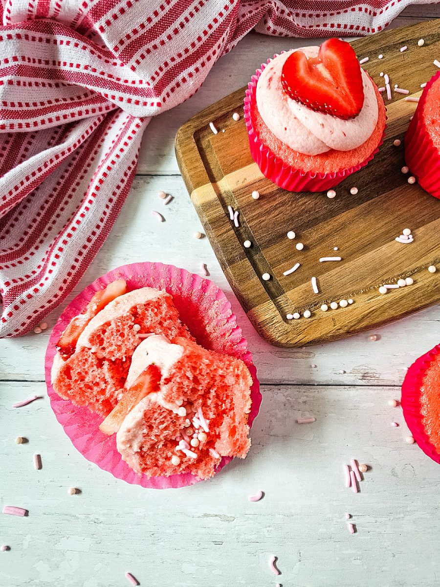 sprinkled filled cupcake cut in half