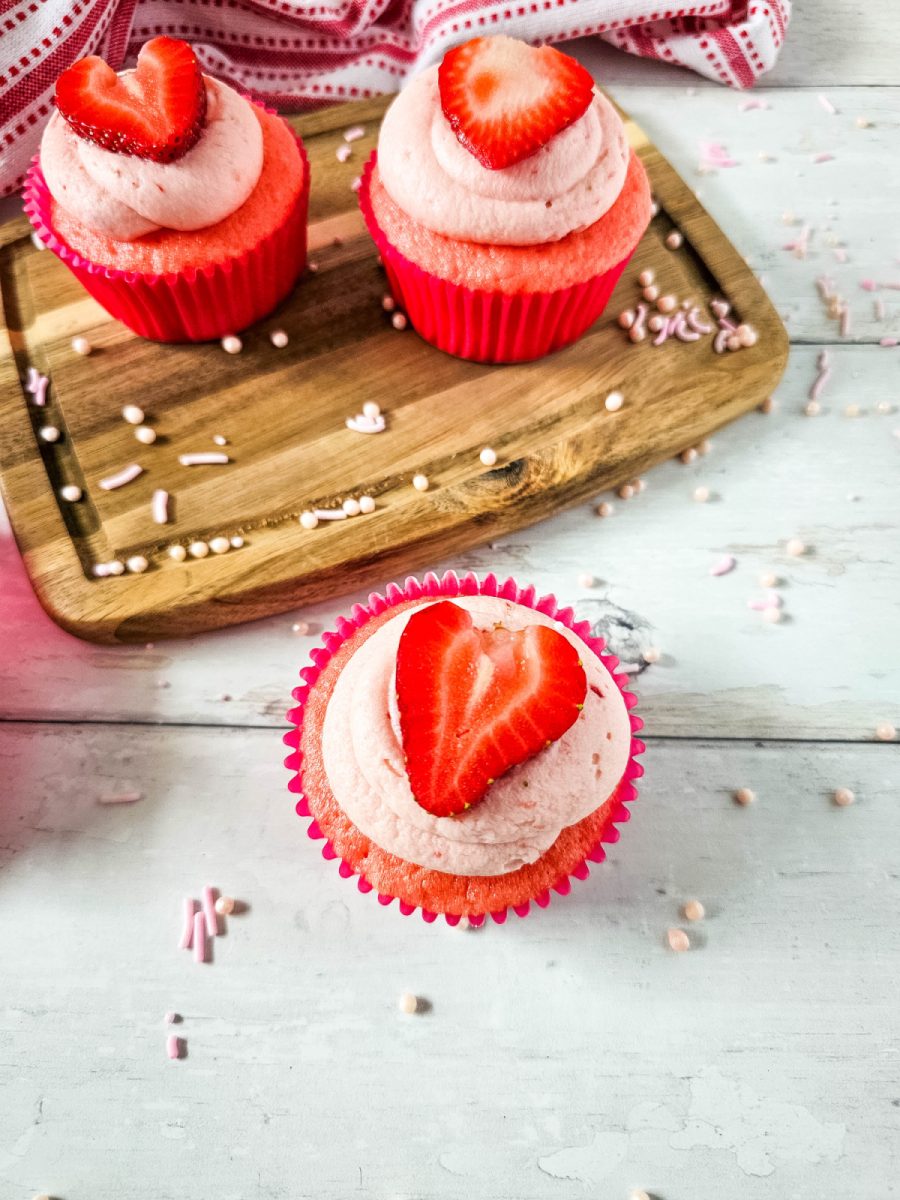 strawberry cupcakes on wooden board