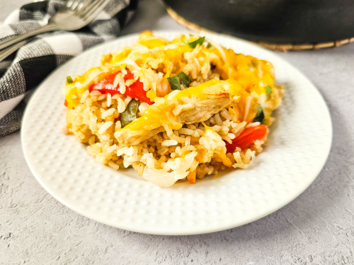 white plate with chicken fajita rice casserole