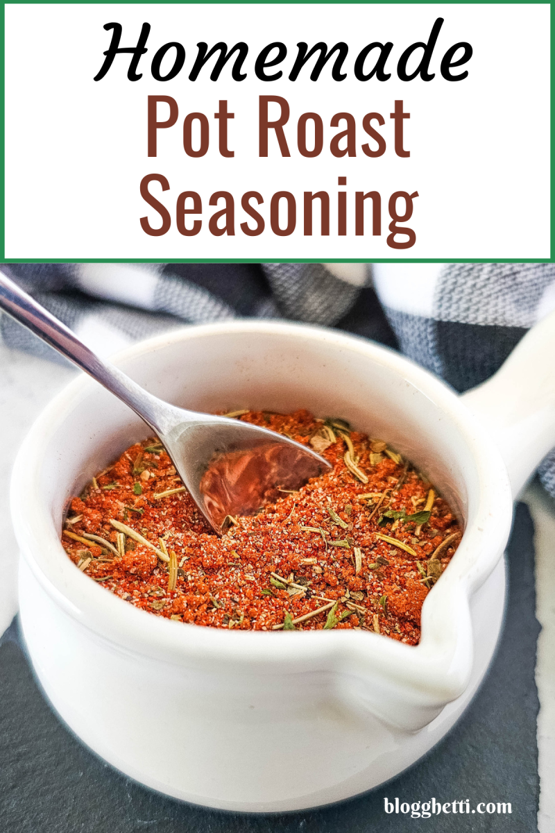 A close-up of a white bowl filled with a vibrant blend of herbs and spices, perfect for seasoning a delicious pot roast.