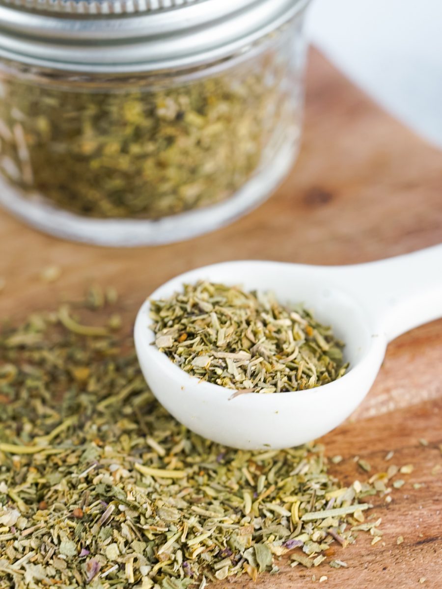 measuring spoon filled with Italian herbs