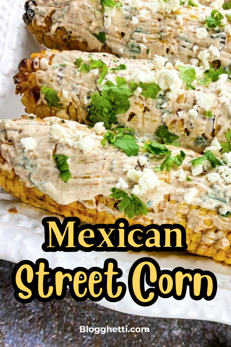 Three ears of grilled corn on a white plate, topped with a creamy sauce and crumbled cotija cheese, garnished with fresh cilantro. The corn has char marks from the grill and is visually appealing. The title "Mexican Street Corn" is written in bold yellow text above the image.