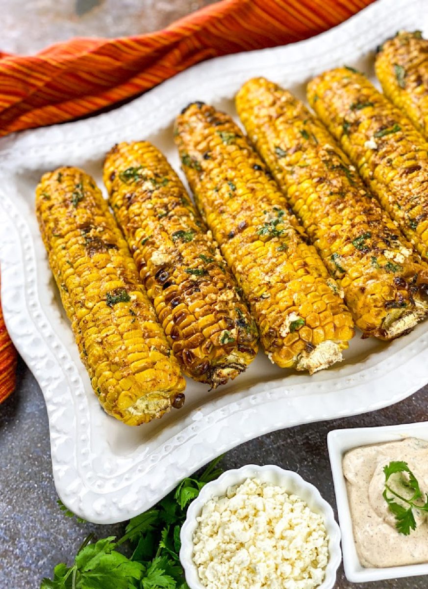 street corn ready to serve with toppings