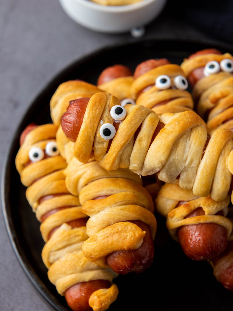 close up of halloween hot dogs on plate