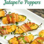 A white platter filled with golden-brown bacon-wrapped jalapeño poppers, garnished with fresh parsley sprigs. The top of the image features a green banner that says "Perfect for Game Day" above the title "Bacon-Wrapped Jalapeño Poppers."