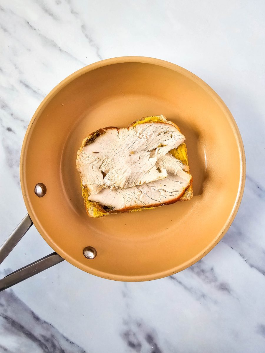 add turkey slices on top of mustard