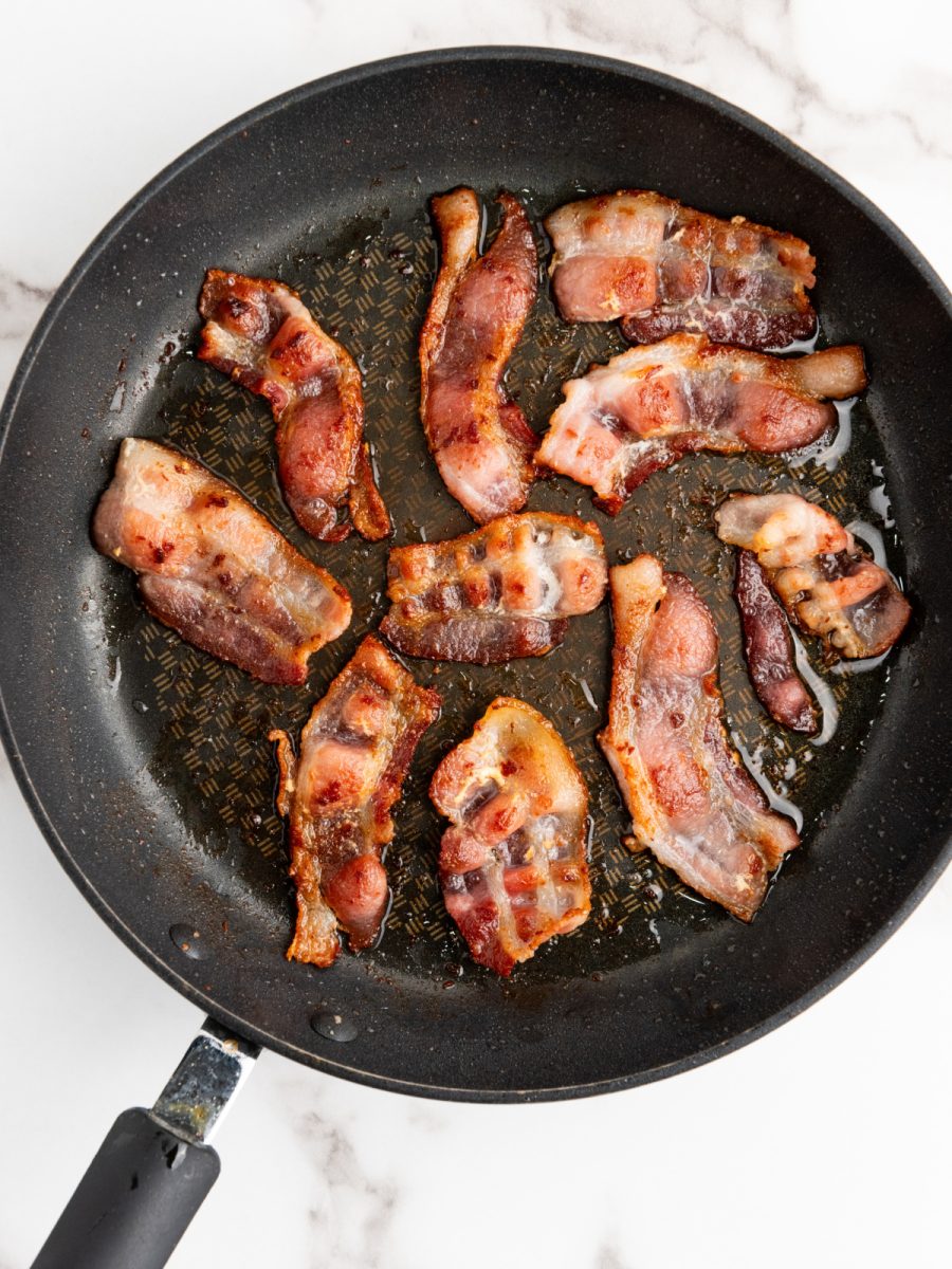 bacon frying in skillet