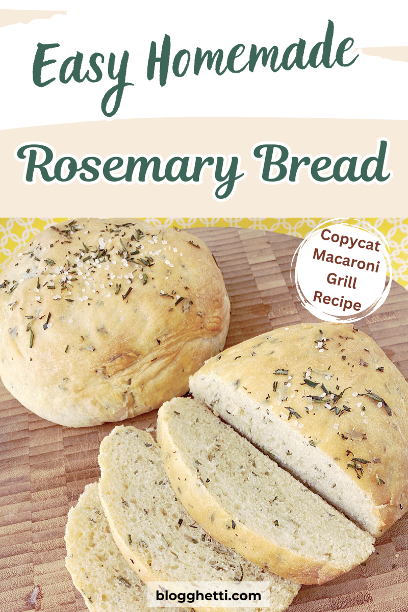 A close-up photo of a loaf of freshly baked rosemary bread. The loaf is golden brown with visible flecks of rosemary and coarse salt. It's sliced on a wooden cutting board, with the slices revealing a soft, fluffy interior.