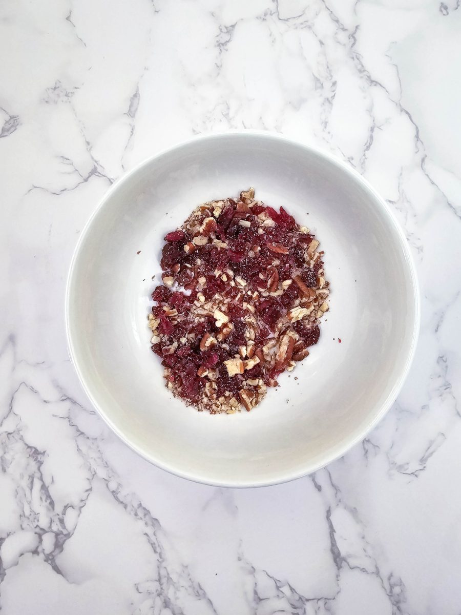 mix pecans and cranberries in bowl