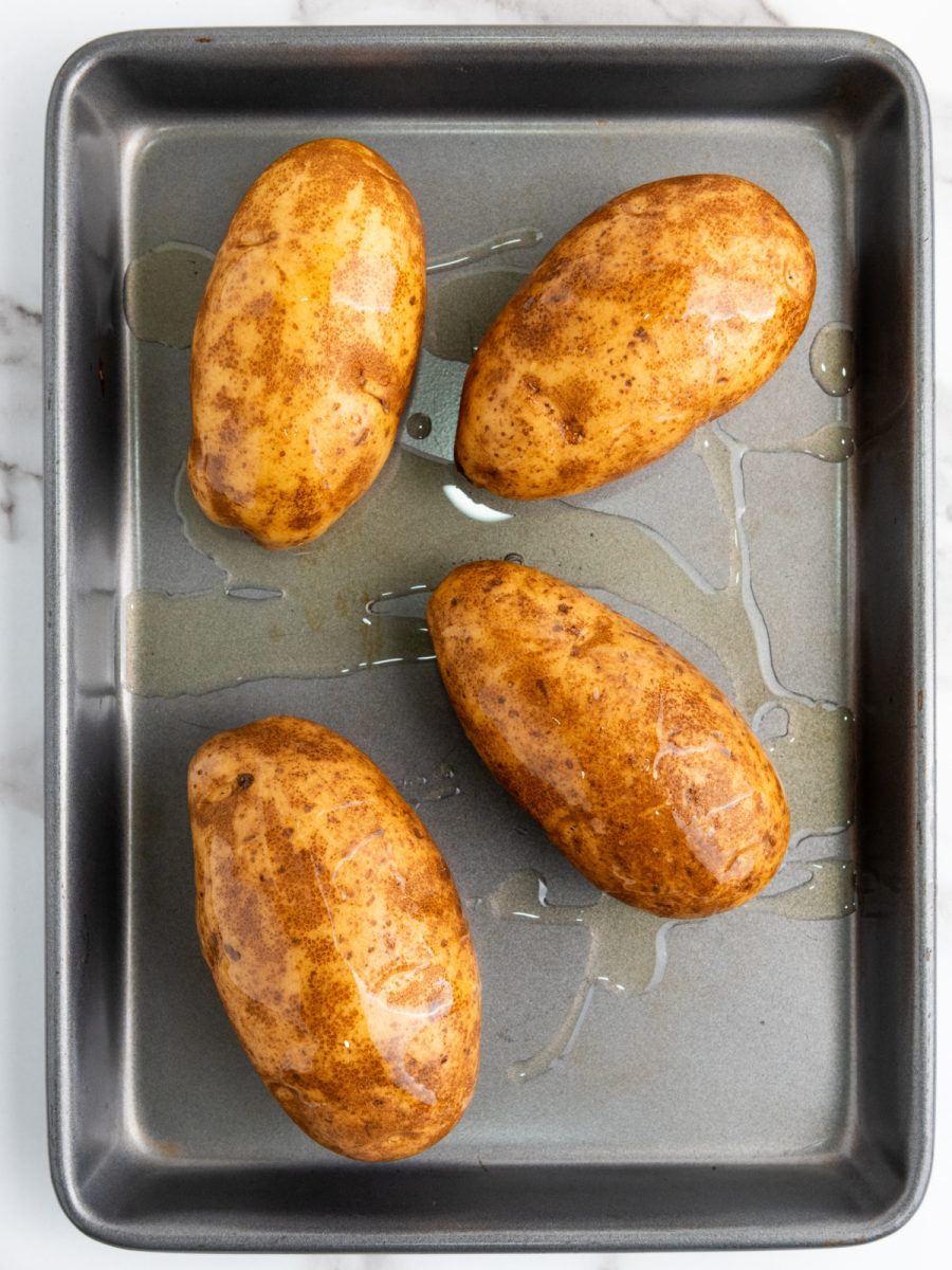 potatoes on baking sheet ready to bake