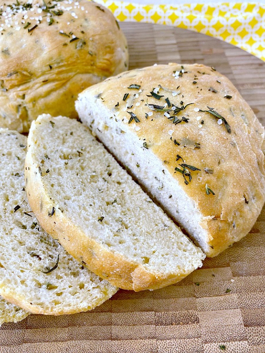 sliced rosemary bread on cutting board