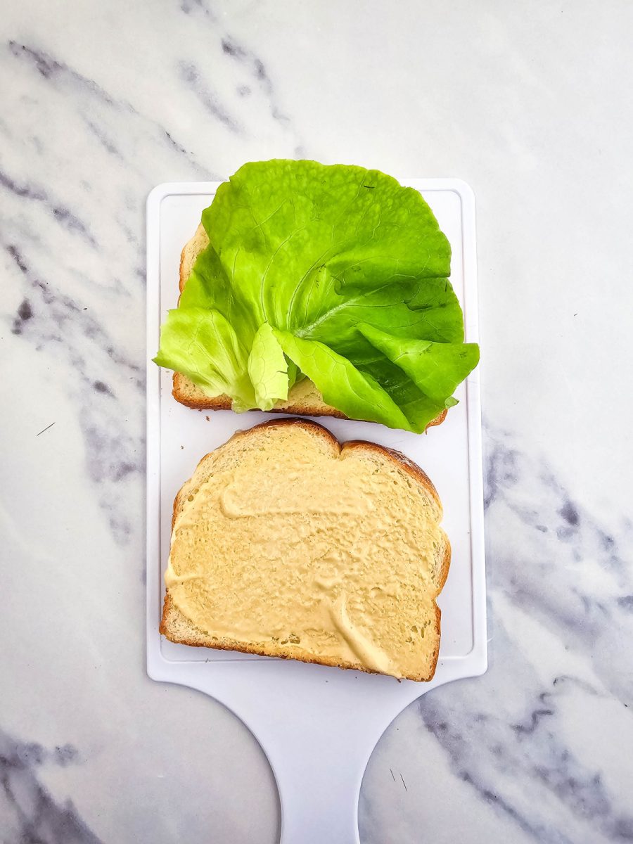 spread condiments on bread add lettuce