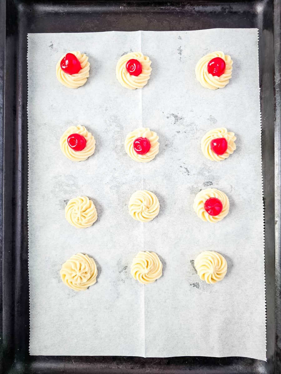 add cherries to some cookies