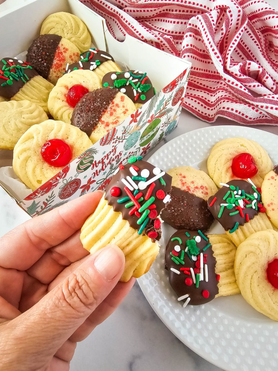 chocolate butter cookie in hand