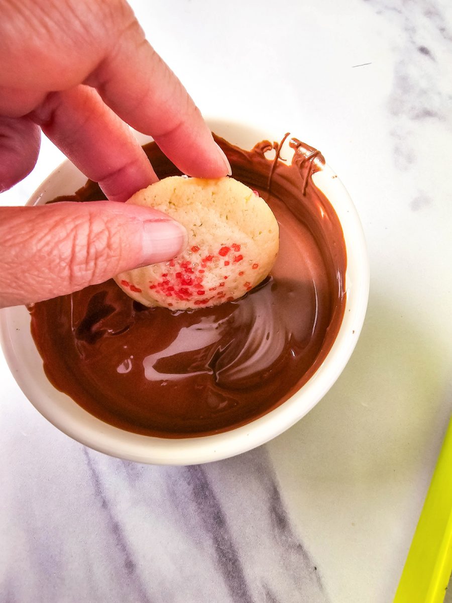 dip sugar crystal cookies into chocolate