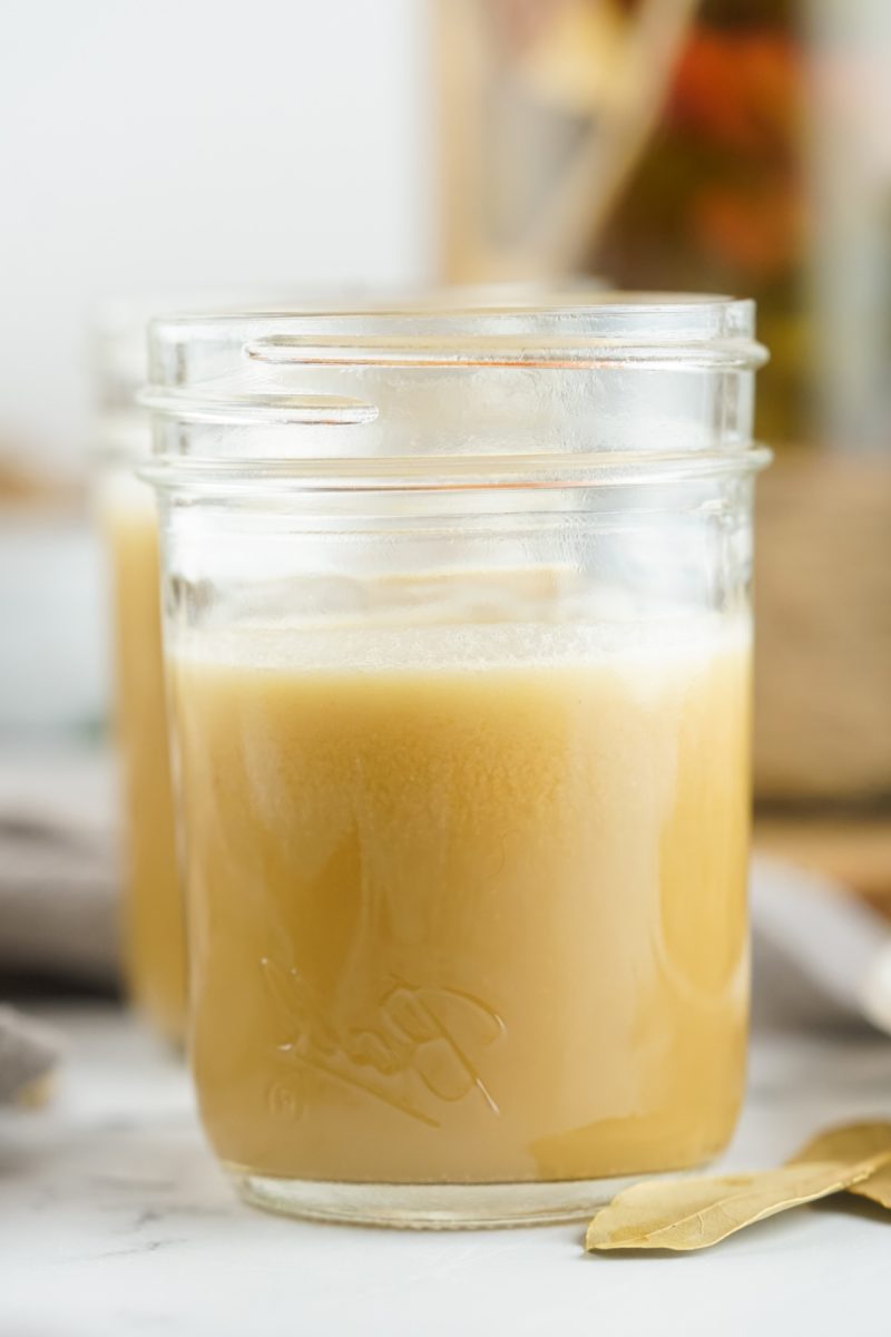 homemade chicken stock with bay leaf