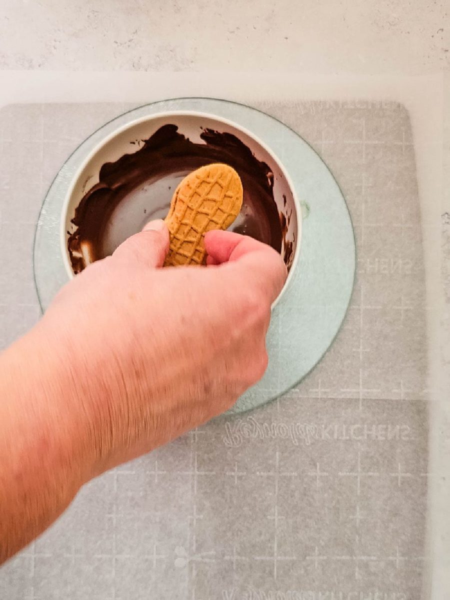 dip one side of cookie into chocolate