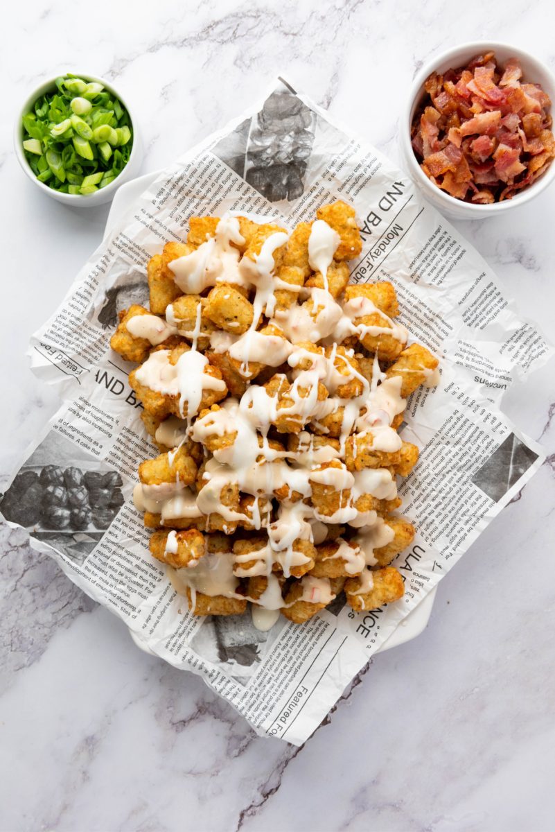 drizzle queso and ranch on tots