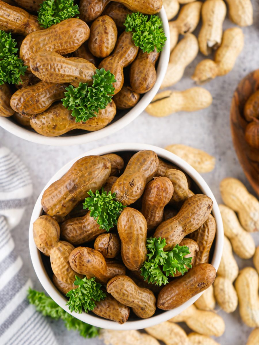 two bowls of cooked unshelled peanuts