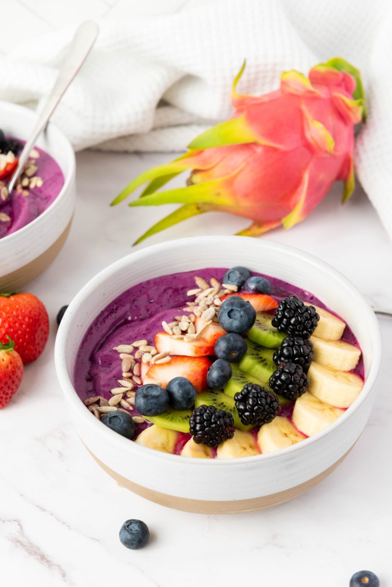 close up blended fruits and toppings in bowl