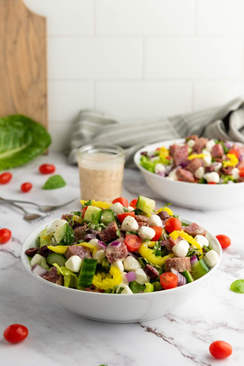 chopped salad with zesty dressing in large bowl