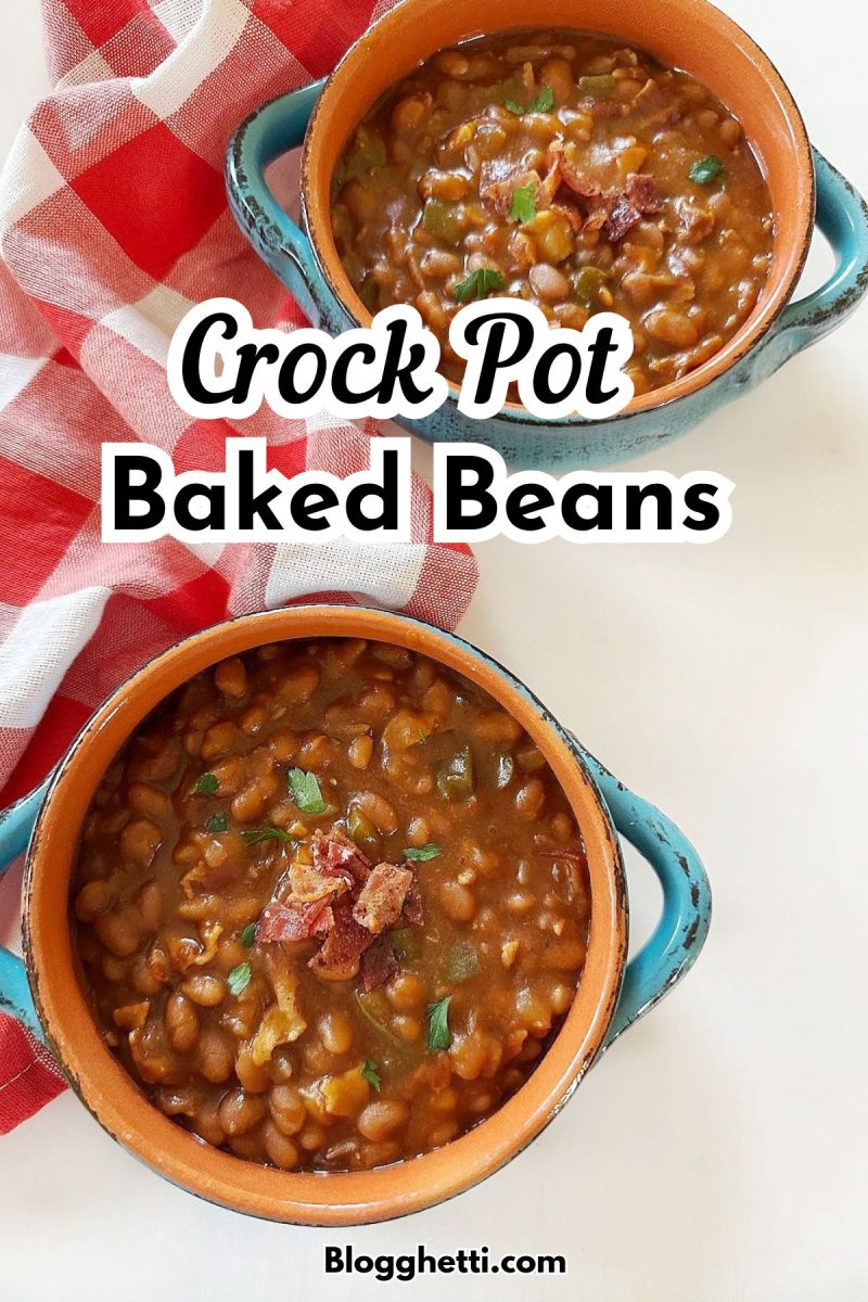 Two blue bowls with orange interiors filled with crock pot baked beans, garnished with bacon and green herbs, placed on a white surface. A red and white checkered cloth is partially visible in the background. The text 'Crock Pot Baked Beans' appears in the center