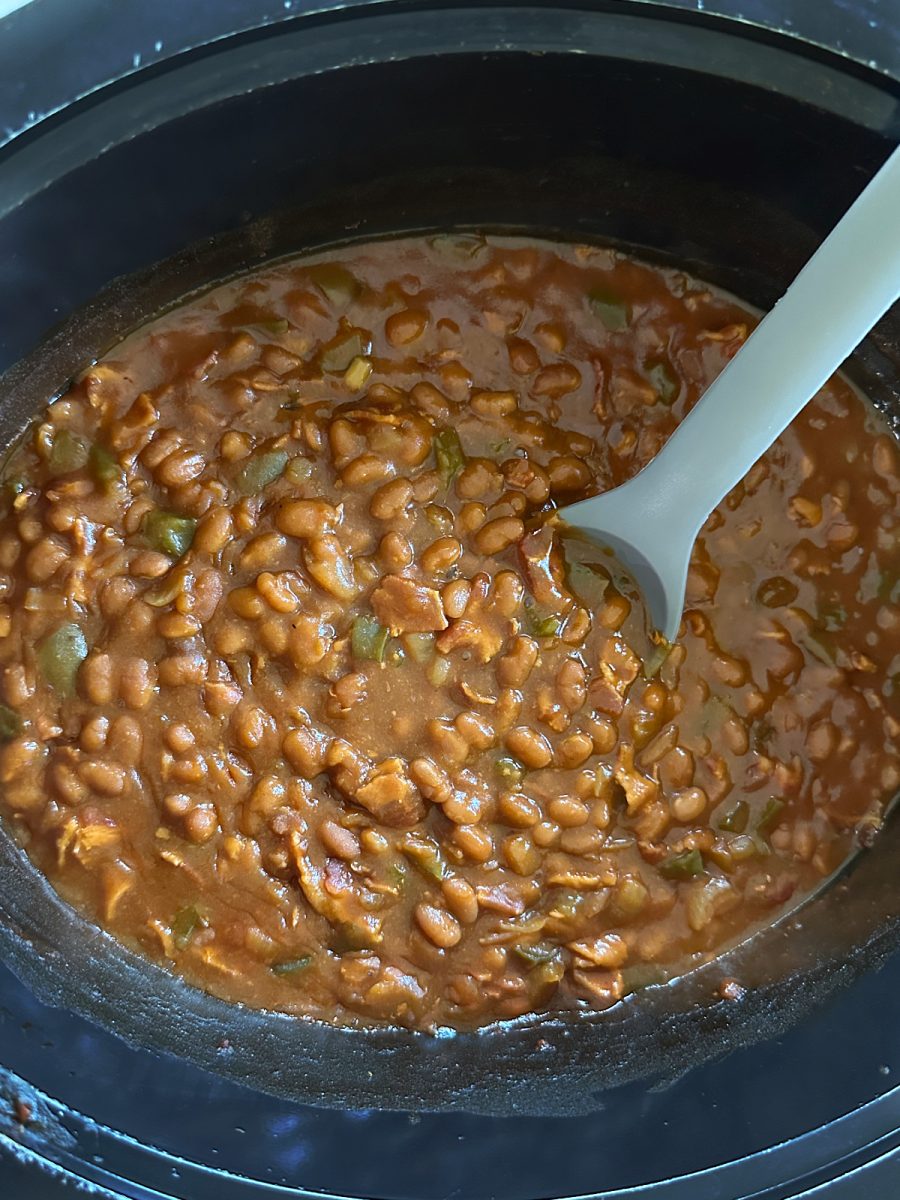 overhead view of baked beans in slow cooker