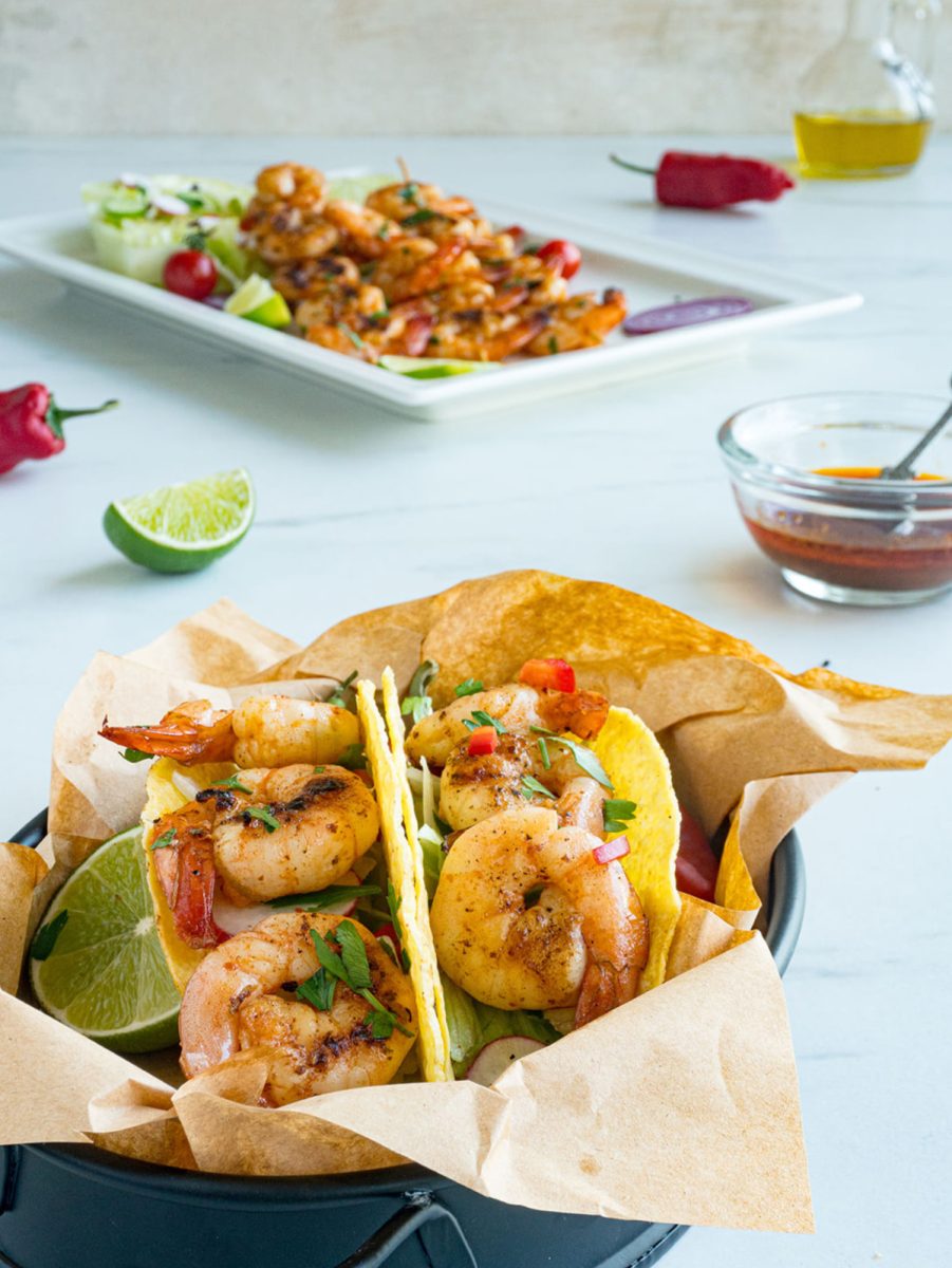 shrimp taco basket close up with platter in background