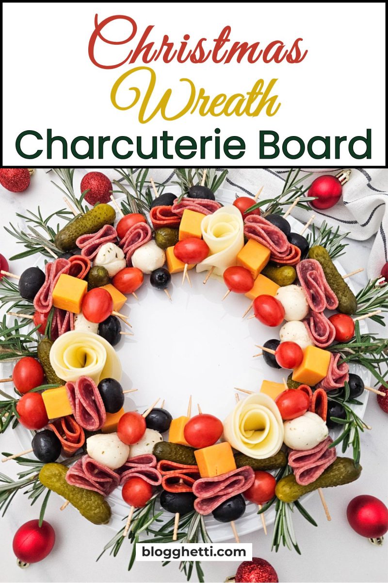 Overhead shot of the completed Simple Christmas Wreath Charcuterie Board on a white platter, garnished with rosemary and surrounded by red Christmas ornaments. The image has a large overlay text box reading "CHRISTMAS CHARCUTERIE WREATH