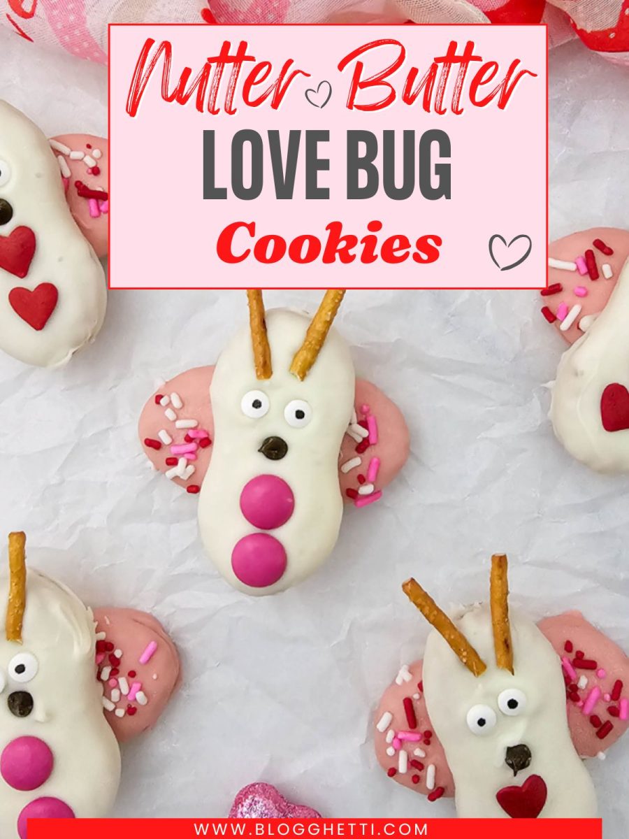 A wide overhead shot of six Nutter Butter love bug cookies spread across parchment paper with scattered pink hearts and a red scarf.
