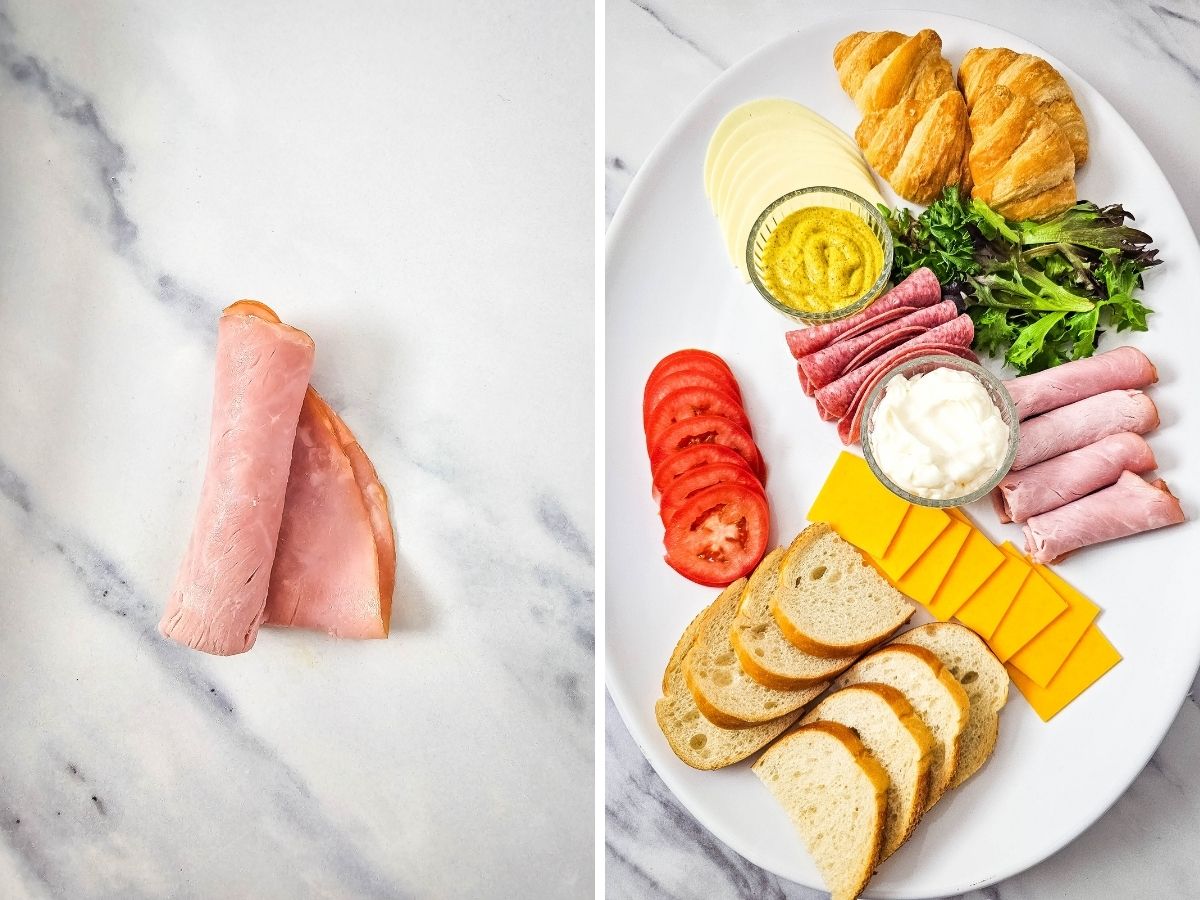 A step-by-step visual of platter assembly on a marble countertop. The left side shows two pieces of deli ham being rolled, while the right side shows those ham rolls and square cheddar slices positioned among the other handheld appetizer components.