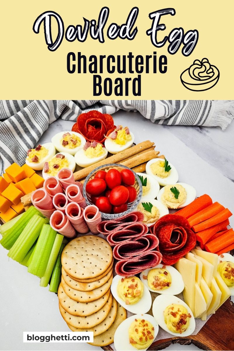 High-angle shot of a full deviled egg appetizer spread on a rustic wood board with a yellow header and a website logo in the corner.