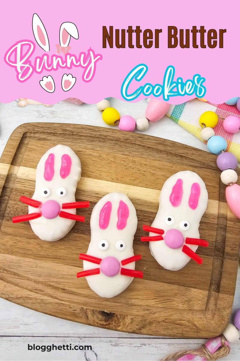 An eye-catching Pinterest graphic featuring three Easter bunny Nutter Butter cookies on a wooden board with a bright pink and blue text overlay reading Bunny Nutter Butter Cookies.