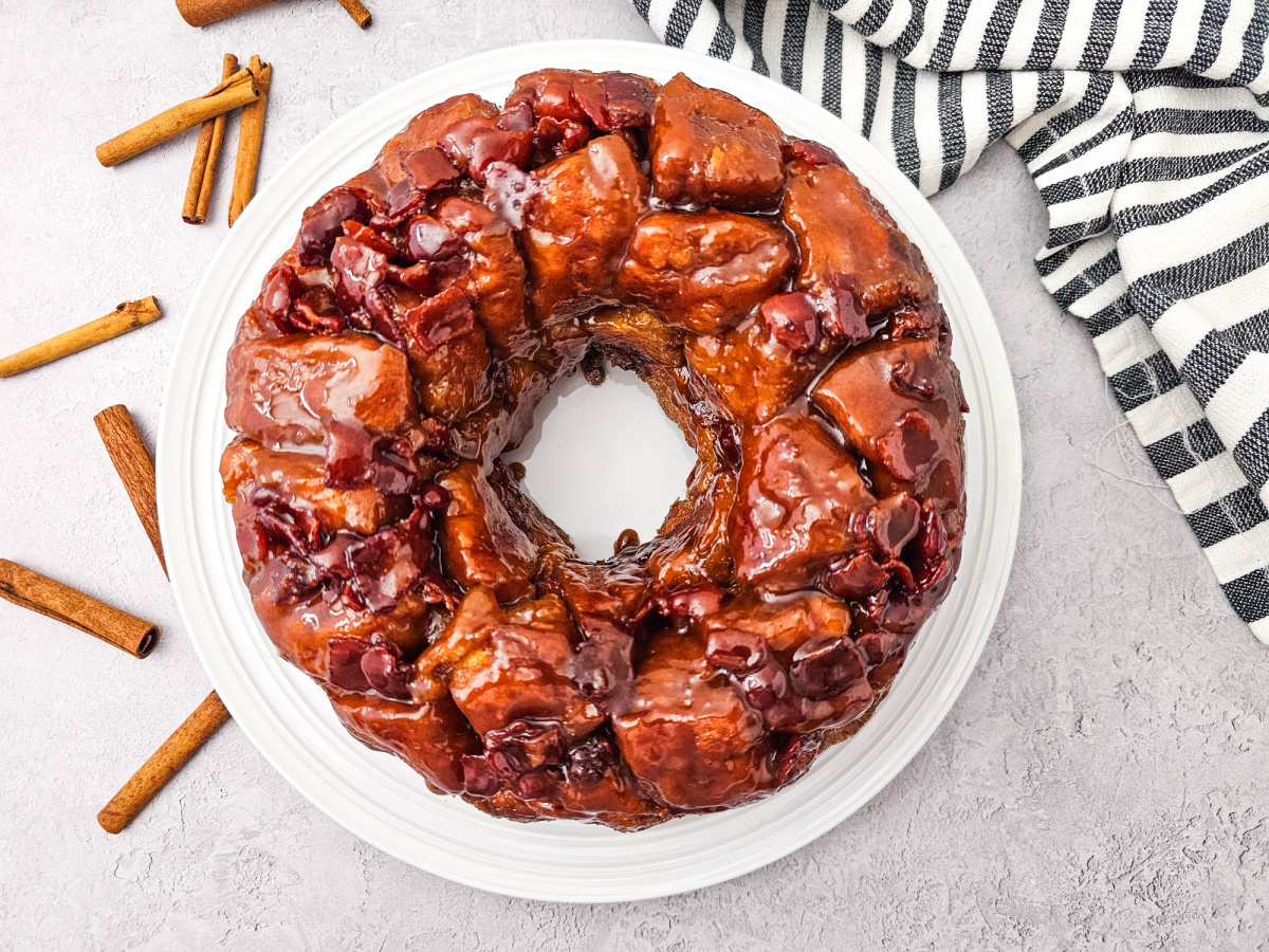 Overhead view of a complete maple bacon monkey bread showing the circular bundt shape and gooey caramel topping.