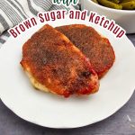 A vertical recipe graphic featuring the arched text "Delicious Pork Chops with Brown Sugar and Ketchup" over an image of two thick, cooked pork chops covered in a seasoned brown glaze on a white serving plate.
